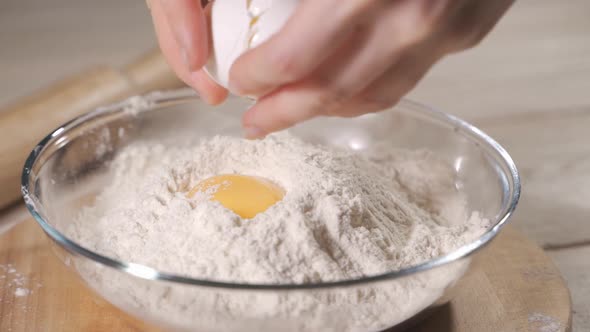 Slow Motion of Falling Eggs Into Flour Stock. Footage Food. Egg Dropping Into Flour, Slow Motion.