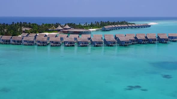 Aerial drone landscape of resort beach by blue sea with sand background