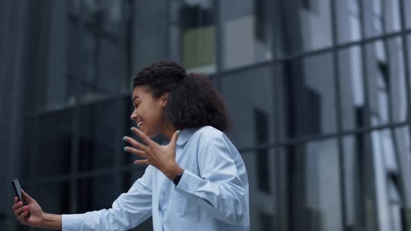 Joyful Woman Making Video Call Posing at Modern Office