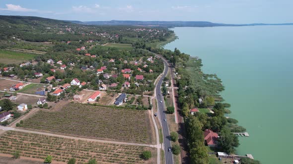 Aerial view of Lake Balaton, road, houses, fields and gardens in Hungary