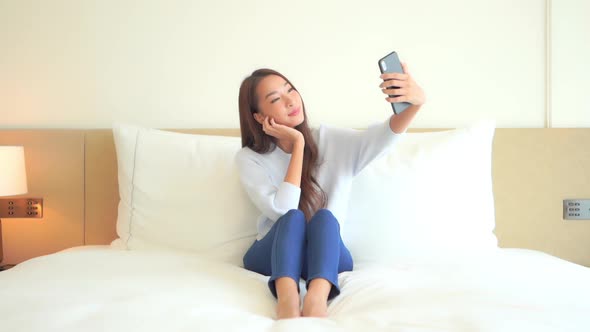 Young asian woman use smart phone