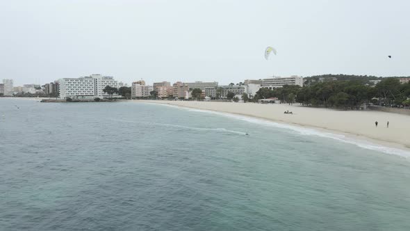 Kitesurfing at the Beautiful Beach in Mallorca Spain  Aerial Drone Shot