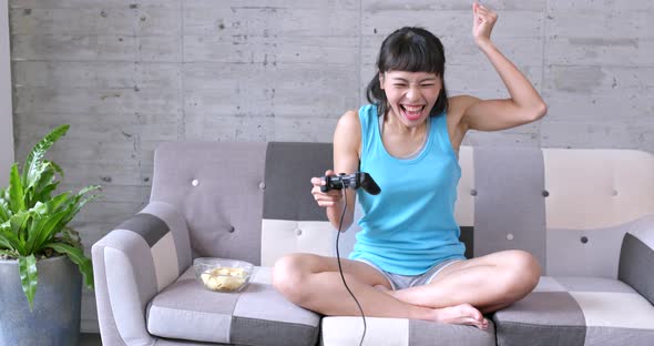 Woman playing tv game at home