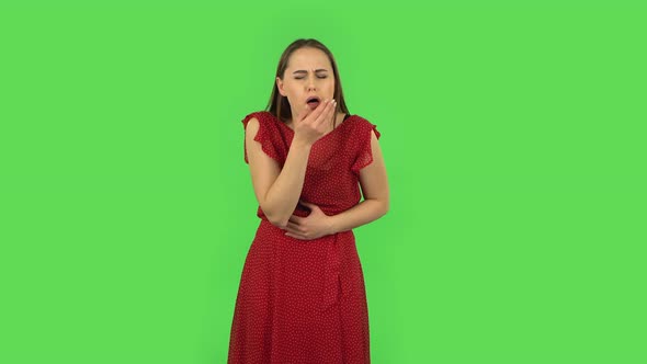 Tender Girl in Red Dress Is Getting a Cold, Sore Throat and Head, Cough. Green Screen