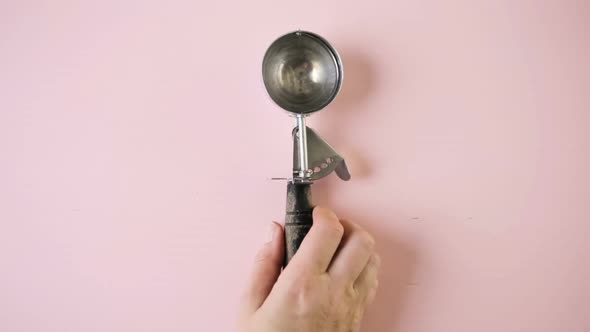 ice cream scoop on a pink background.
