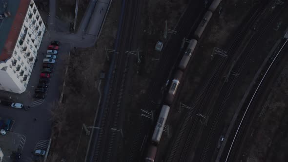 Birds Eye View of a Passenger Train Passing By From City and Trees in Berlin Germany Surrounded By