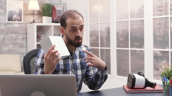 Young Influencer Holding a Box While Recording a Vlog