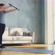 Woman Does Sports Exercises with Dumbbell Bars in Room - VideoHive Item for Sale