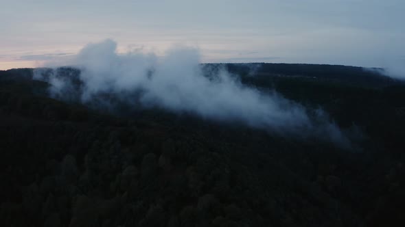 aerial view of low clouds over the forest