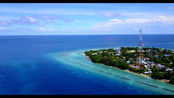 Aerial scenery of idyllic shore beach trip by blue lagoon and white sand background of adventure nea