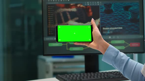 Close Up of Scientist Woman Holding Smartphone with Green Mockup