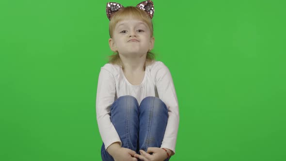 Girl in Jeans and Headband with a Cat Ears. Happy Four Years Old Child. Chroma