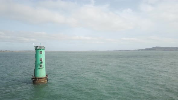 North Bull Lighthouse In The Middle Of A Calm Water During Daytime In Dublin Bay, Ireland. - Pullbac