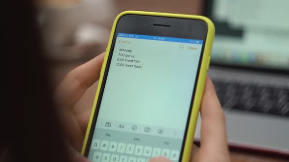 Female Types Text on Phone Closeup Sends a Message Makes a Plan for the Day