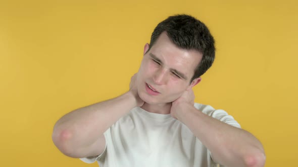 Man with Neck Pain, Yellow Background