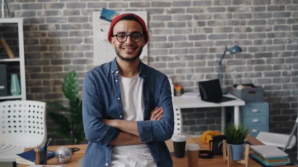 Portrait of Young Man Entrepreneur Standing in Workplace Smiling