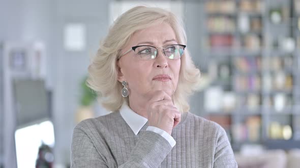 Portrait of Thoughtful Old Woman Thinking