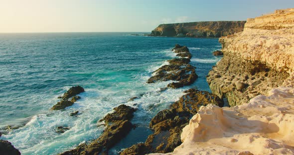 Sunset Soft Light on Famous Caves Rocky Coastline of Little City Ajuy Stone Beach in the South of