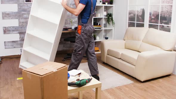 Male Worker Checking New Furniture After He Finished to Assemble It