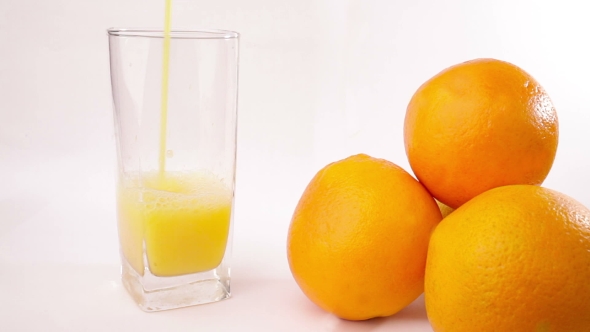 Orange Juice Pouring Into Glass