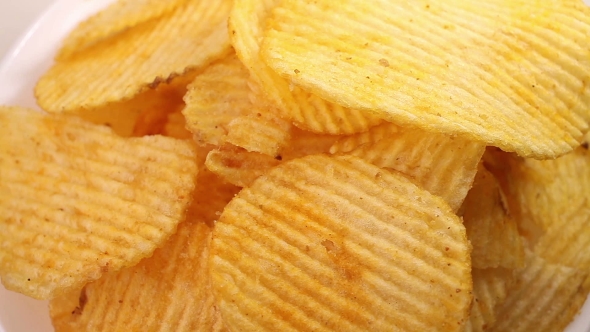 Potato Chips Heap Rotating Over White Background,  View