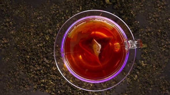 Tea Being Poured Into Glass Tea Cup