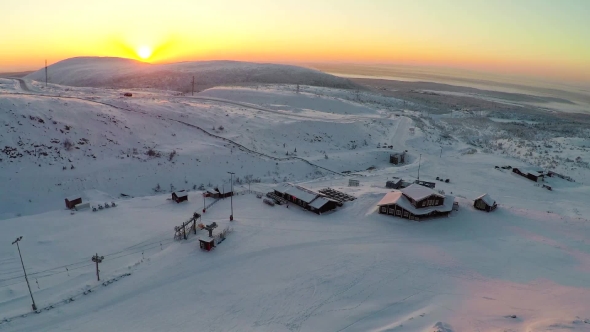 Flying Over Ski Resort In The North At Sunset