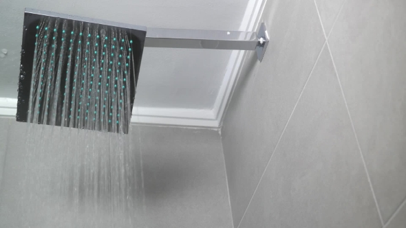 Hot Water Flowing From Square Shower Head