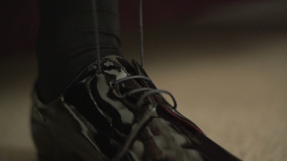 Shoes Tying. Businessman Is Tying Shoe Before a Meeting.