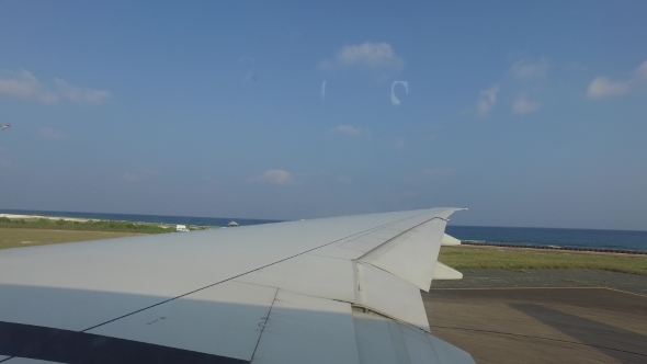 Wing Of Airplane Gathering Speed On Runway 1