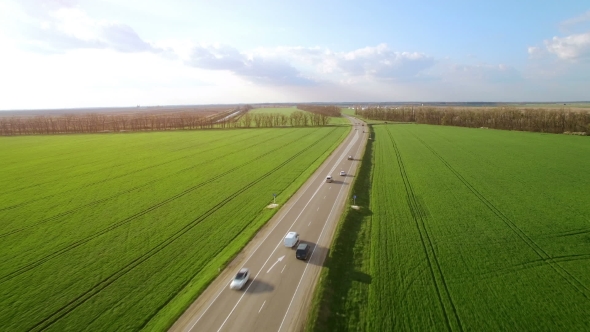Aerial View Flight Above Cars Driving On Country Road alt