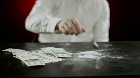 Folding Money On The Table 
