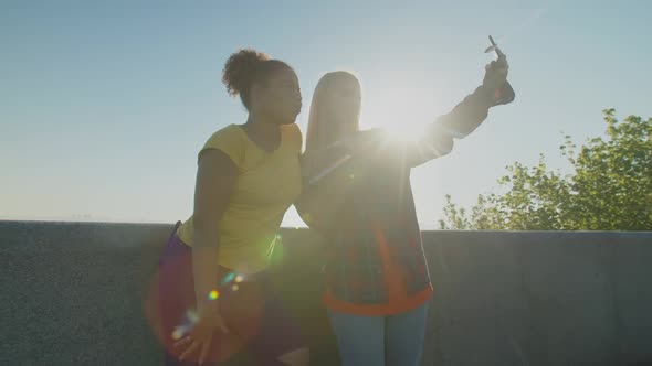 Mischievous Multiethnic Females Enjoying Leisure at Daybreak