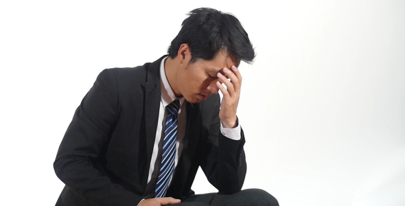 Asian Businessman Tired and Desperate