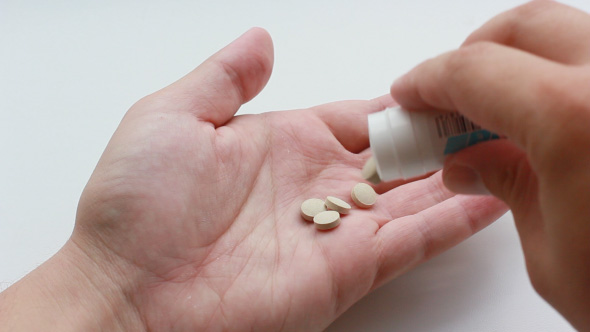 Patient Takes Pills From The Medical Packaging