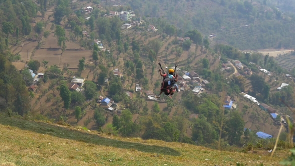 Paragliding Tandem Starts With a Passenger