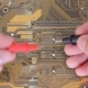 Man Measures Digital Millimeter Motherboard And Processor. - VideoHive Item for Sale
