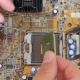 Man Pulls Out a Computer Processor From The Motherboard - VideoHive Item for Sale