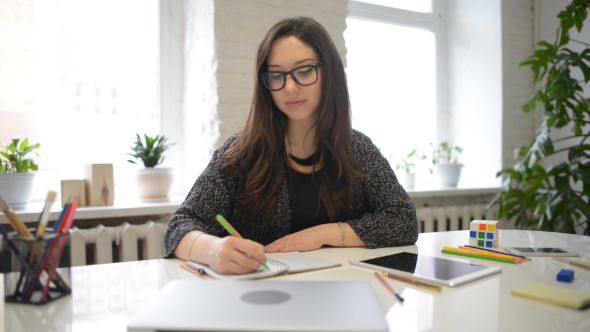 Beautiful Girl Writing on Notebook, Busy at Work