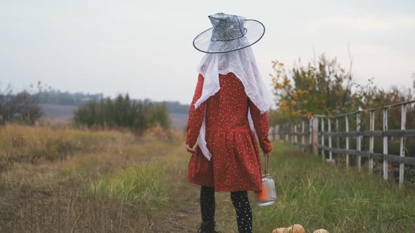 Rear View of Girl Dressed for Halloween