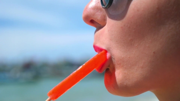  Woman Lips Licking Sweet Lollipop Outdoor
