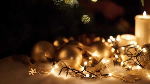 Girl Puts a Christmas Toy On a Christmas Background