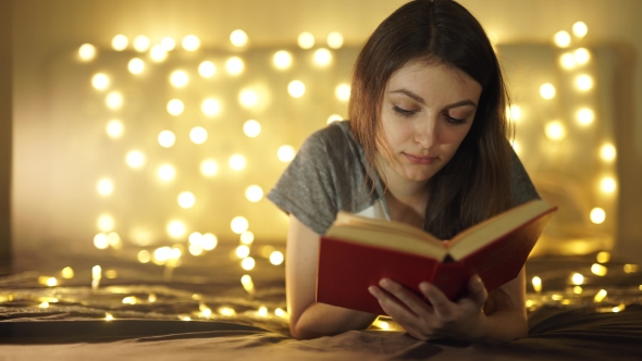 Vintage Portrait Of Cute Curly School Girl Reading a Book In Cold Day