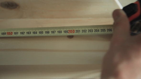 Measuring Wood With Measuring Tape