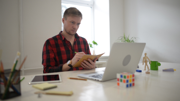 Freelancer Working in His Creative Office