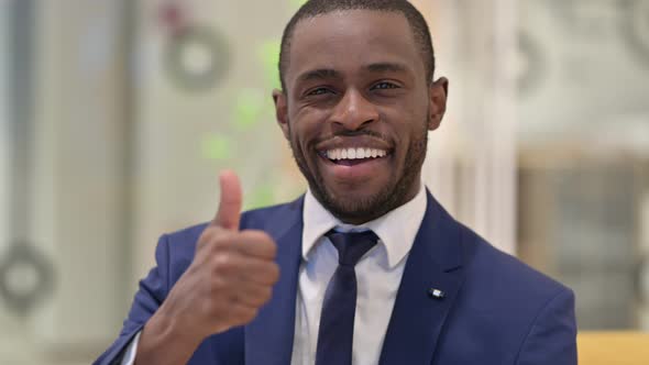 Portrait of African Businessman Showing Thumbs Up Sign 