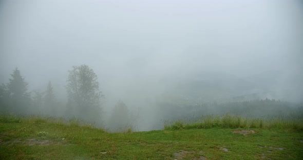 Slow Motion. Fog Rising From the Top of the Mountains