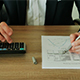 Businessman Checks the Calculations on a Calculator in the Office - VideoHive Item for Sale