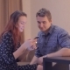 Young Couple Looks At The Phone At Home - VideoHive Item for Sale