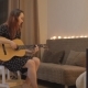 Young Girl Playing The Guitar At Home - VideoHive Item for Sale